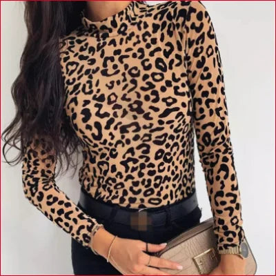 Leopard turtleneck blouse featuring a long-sleeved design and high neckline