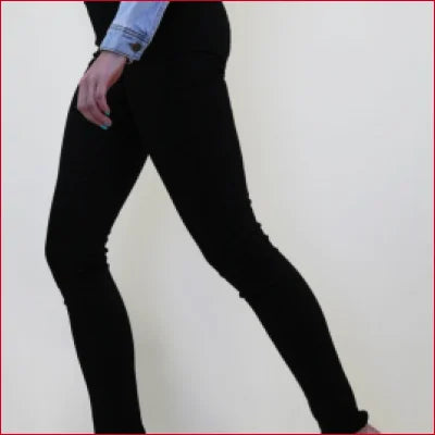 Person wearing Classic Black Skinny Jeans with Stretch Denim for comfort and style