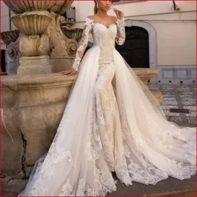 Elegant off-shoulder lace wedding gown with long detachable train and sleeves in White and Ivory