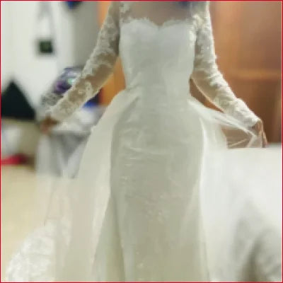 Long Detachable Train Lace Sleeves Wedding Dress featuring a fitted bodice and flowing skirt