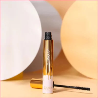 Gold and white Fashionable Black Mascara tube with applicator brush for stunning eyes