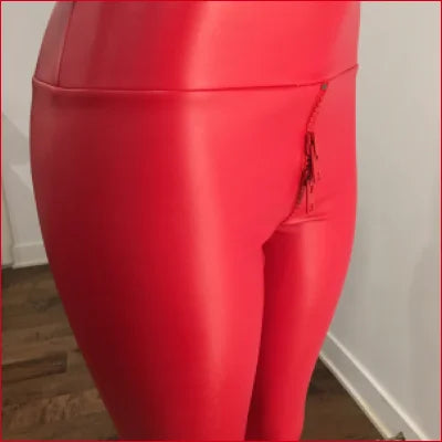 Bright red double head zipper leggings with side pocket for a bold, stylish look