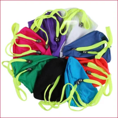 Colorful fabric face masks with neon yellow straps and a Sexy Men’s Penis Pouch Bag