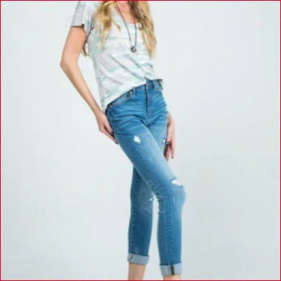 Pair of Stretchy Denim Jeans with Distressed Details and a White T-Shirt