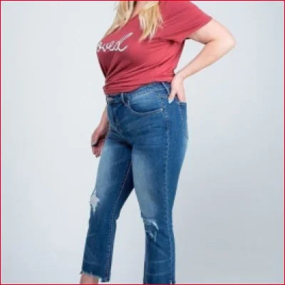 Pair of Vintage Kick Flare Jeans with Ankle Length Distressed Hem worn with a red top