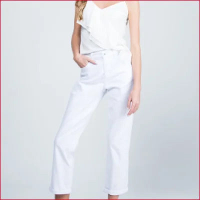 White sleeveless jumpsuit with fitted waist paired with Off-White Midrise Boyfriend Jeans