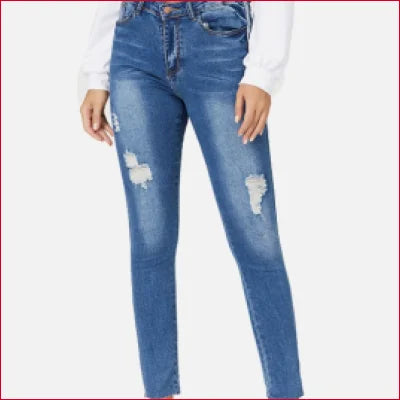 Distressed blue skinny jeans with rips, fading, and flattering fit for trendy style