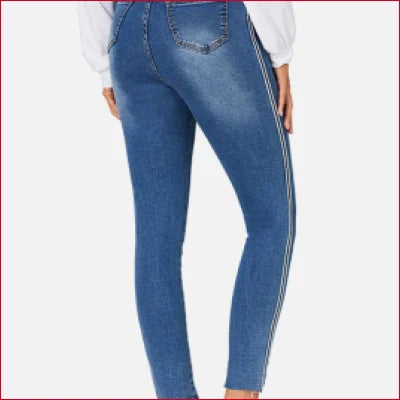 Blue skinny jeans with white stripe detail and crotch zipper for a flattering fit