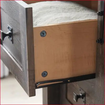 Open wooden drawer showcasing metal hardware in a Modern Farmhouse dresser with barn door