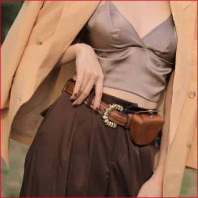 Stylish brown leather belt with decorative buckle paired with Mulberry Silk Bra