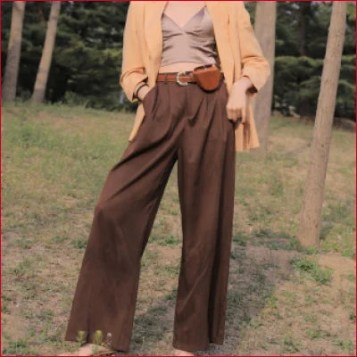 Wide-leg brown trousers with beige top and yellow cardigan featuring a mulberry silk bra