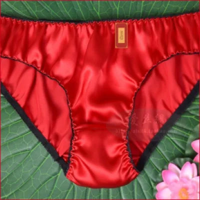 Red satin women’s mulberry silk panties with black trim, available in sizes XS-XXL