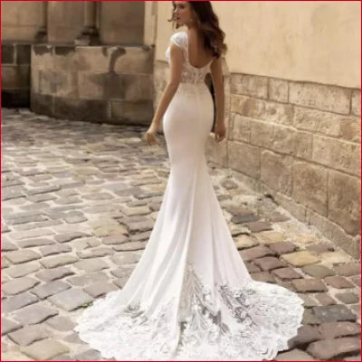 Elegant Mermaid Open Back Wedding Dress with Lace Details and Sweep Train in White