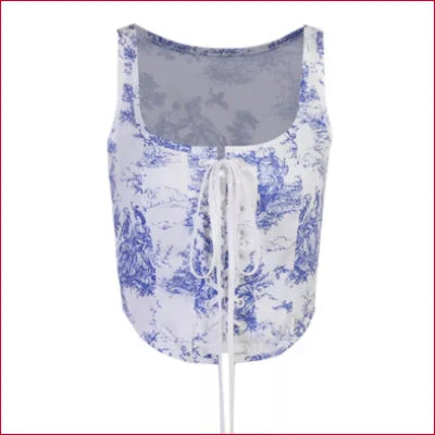 Sleeveless top with blue floral pattern and front tie closure featuring white flower motifs