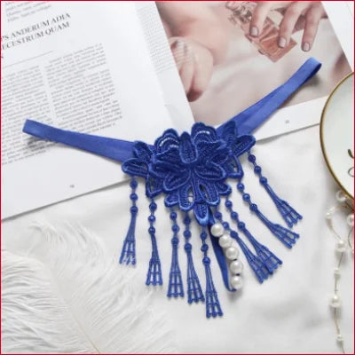 Blue lace choker necklace with tassels showcasing an erotic fashion statement for size panties