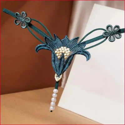 Decorative teal floral bookmark with pearl accents for Intimate Faux Pearl G-String Panties