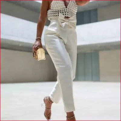 White high-waisted pants with beaded waistband paired with Y2K Faux Pearl Tank for women