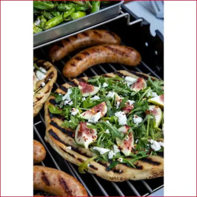 Grilled pizza with figs, arugula, and cheese on a Performance Series Silver propane gas grill