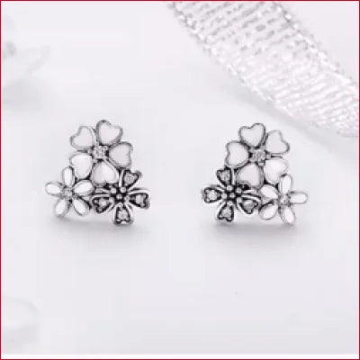 Sterling Silver Stud Earrings featuring delicate pink daisies floral designs