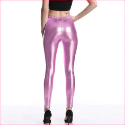 Shiny pink disco pants leggings on model, available in sizes S-XXXL