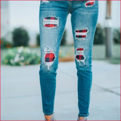 High Waist Destroyed Jeans with Plaid Patch showing blue denim and red fabric underneath