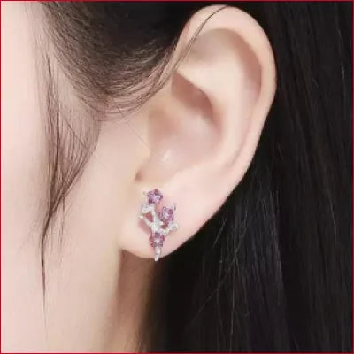 Delicate floral-shaped Sterling Silver Flowers Stud Earrings with Plum Zircon gemstones