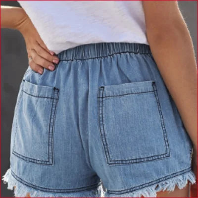 Light blue casual denim shorts with frayed hems and elastic waistband for a chic look