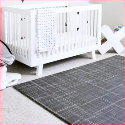 Gray and white patterned rug on Premium Stylish Foam Play Mat for soft, safe play