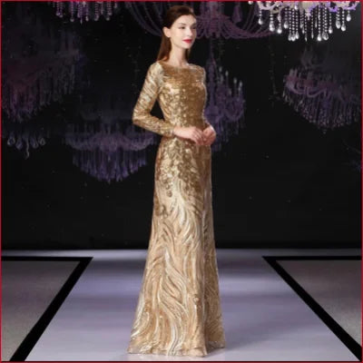 Elegant gold sequinned prom formal evening dress with long sleeves and floor-length skirt