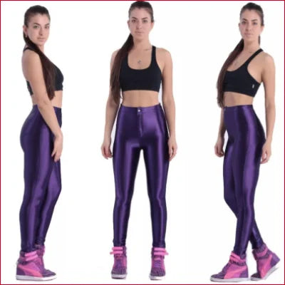 Purple Disco Women’s high-waisted shiny leggings paired with black sports bras and pink sneakers