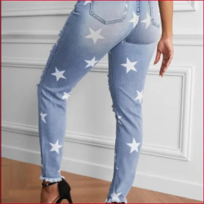 Light blue star printed jeans with ripped details and a crotch zipper for casual style