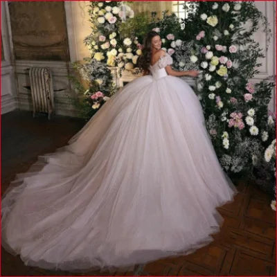 Voluminous Off Shoulder Wedding Dress with Glitter and Long Train for Elegant Brides