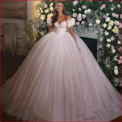 Voluminous white off shoulder wedding dress glitter bridal gown with ruffled sleeves