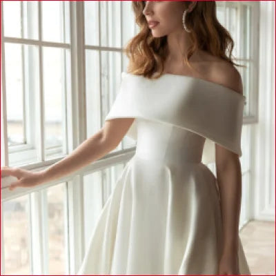 Elegant Satin Off Shoulder Bridal Gown featuring a flowing skirt and off-the-shoulder design