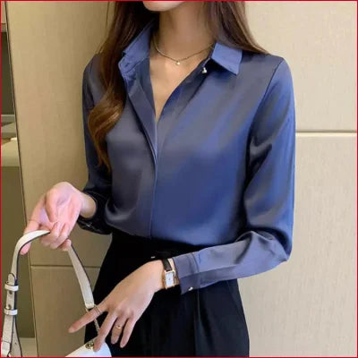 Blue satin silk women’s blouse with collar and long sleeves in elegant blue color