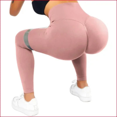 Pink scrunch butt leggings on a person, perfect for a flattering fit and stylish look