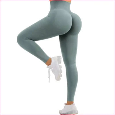 Teal scrunch butt leggings paired with white sneakers for stylish comfort and fit