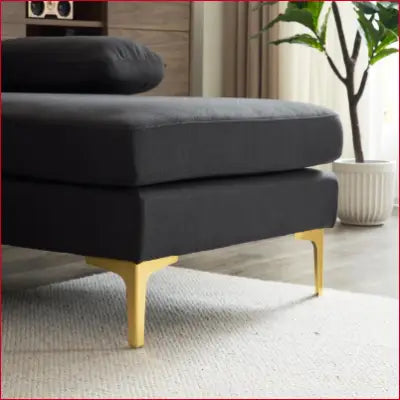 Charcoal chaise lounge with gold legs on a soft linen fabric sectional sofa couch set