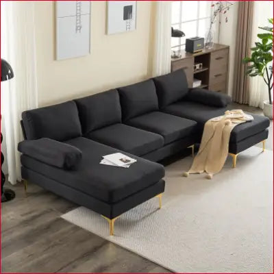 Black velvet sectional sofa with gold legs in a convertible couch set for living room