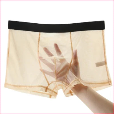 Beige boxer shorts lingerie with black waistband and hand reaching through fabric