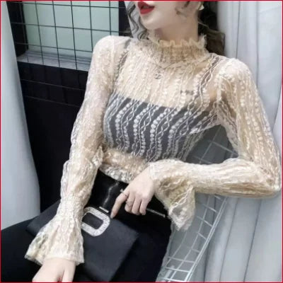 Lacy white long-sleeved lace blouse with high neck and flared cuffs for elegant outfits