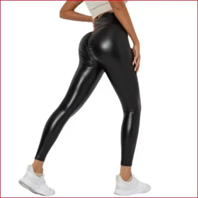 Shiny black high-waisted scrunch butt leggings for women, featuring sexy black leather