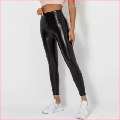 Sexy black leather scrunch butt leggings paired with white sneakers for a stylish look