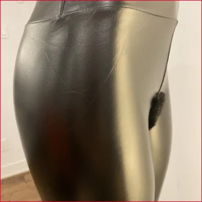 Shiny black mannequin torso showcasing Vegan Black Leather Leggings for BDSM Fetish