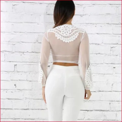 Cropped white lace-detailed sheer top showcasing a stylish and sexy look from behind