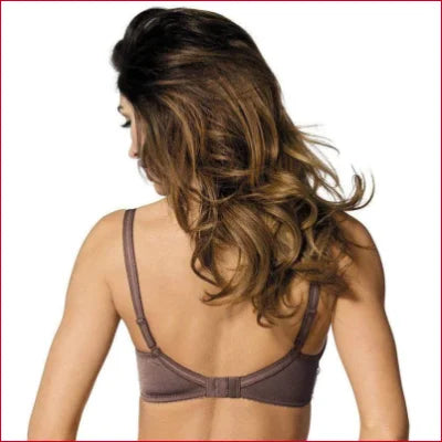 Woman’s back in brown bra with wavy hair showcasing Gorteks Lingerie sheer lace balcony