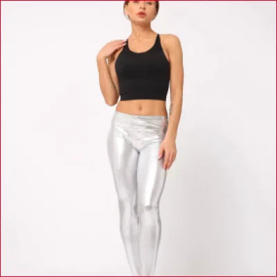 Woman in a black crop top and silver disco pants shiny candy leggings outfit