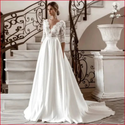 Elegant Satin Bridal Gown in White with Lace Sleeves and Flowing Skirt