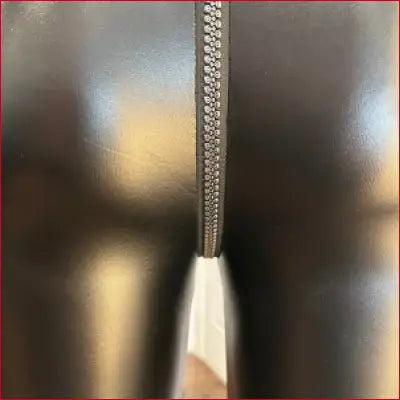 Metal zipper with white fabric pull tab on Sexy Skull Teeth Crotch Zipper Faux Leather Leggings