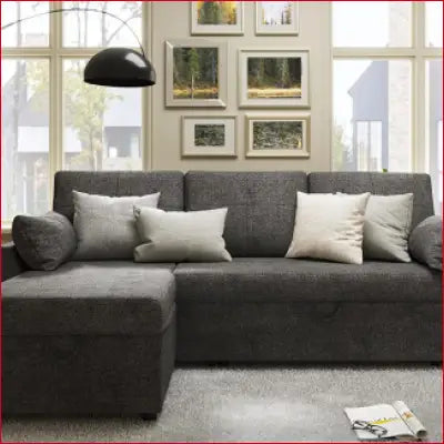 Gray sectional sleeper sofa with storage chaise and decorative pillows for the living room